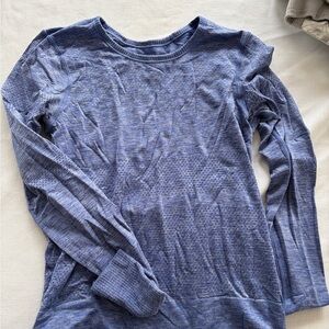 Lululemon Athletica workout top. Small hole in arm